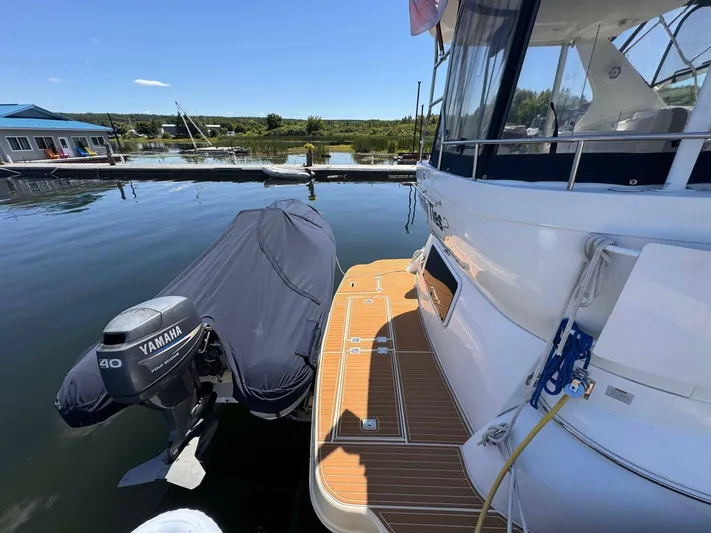  Yacht Photos Pics 2002 Cruisers Yachts 4450 Express Motor Yacht docked with Yamaha outboard motor.