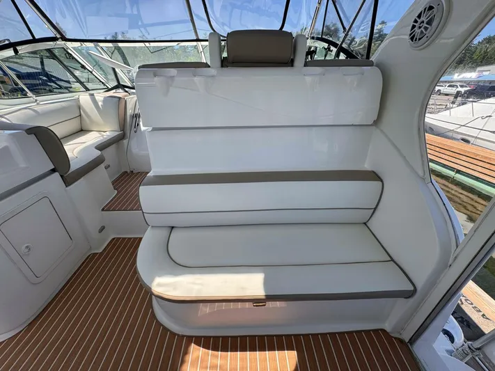  Yacht Photos Pics 2002 Cruisers Yachts 4450 Express Motor Yacht interior with white seating and wood flooring.