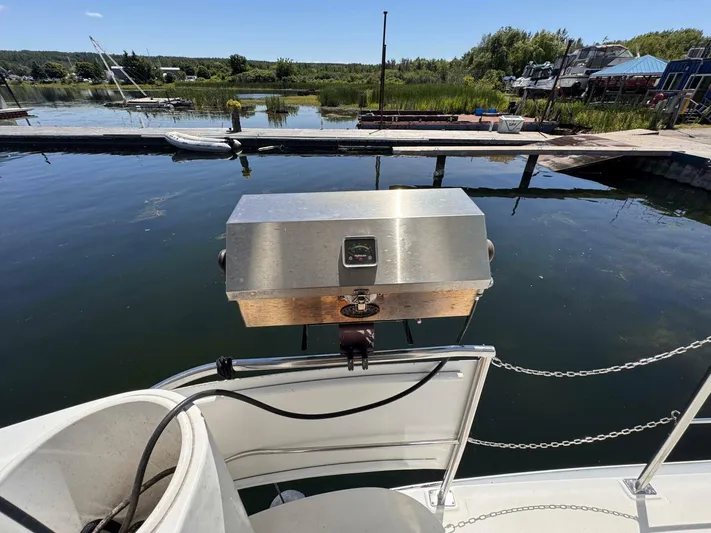  Yacht Photos Pics 2002 Cruisers Yachts 4450 Express Motor Yacht with grill at dockside.