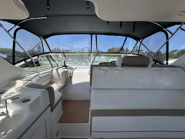  Yacht Photos Pics 2002 Cruisers Yachts 4450 Express Motor Yacht interior with seating and helm.