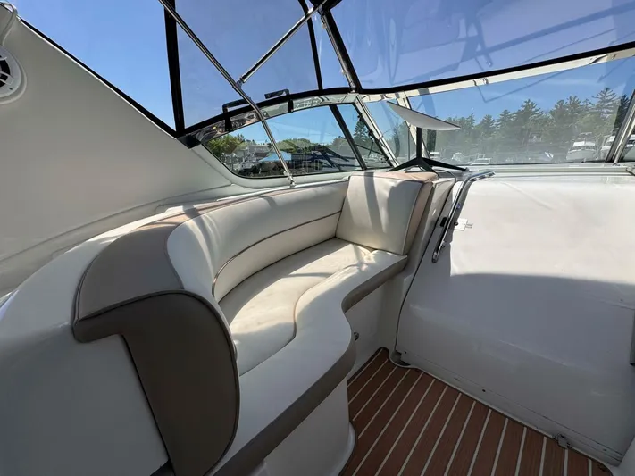  Yacht Photos Pics 2002 Cruisers Yachts 4450 Express Motor Yacht interior with cushioned seating and clear windows.