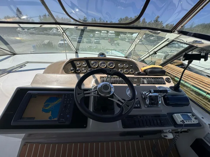  Yacht Photos Pics Cockpit view of 2002 Cruisers Yachts 4450 Express Motor Yacht with navigation equipment.
