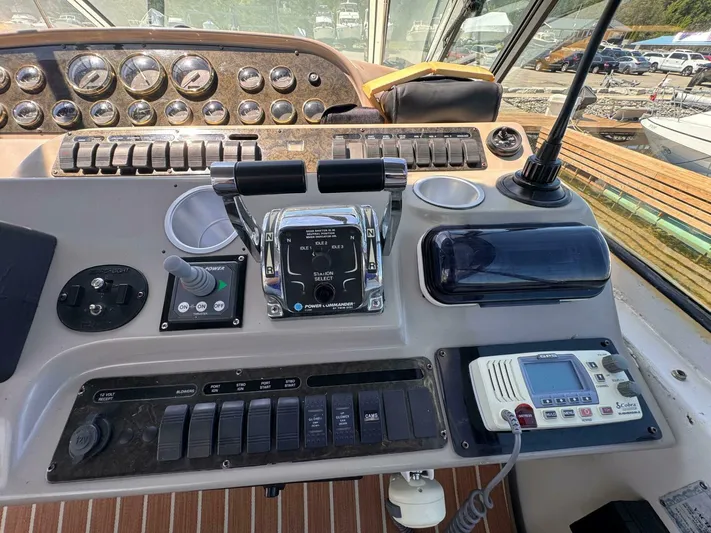  Yacht Photos Pics Helm of 2002 Cruisers Yachts 4450 Express Motor Yacht with controls and gauges.