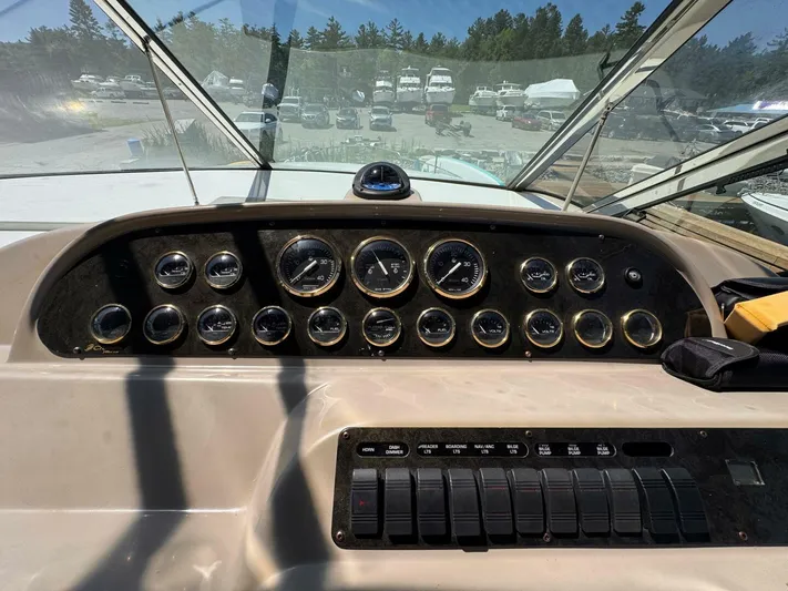  Yacht Photos Pics 2002 Cruisers Yachts 4450 Express Motor Yacht dashboard with gauges and controls.