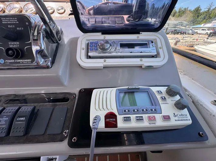  Yacht Photos Pics Control panel of 2002 Cruisers Yachts 4450 Express Motor Yacht with radio and navigation equipment.
