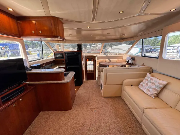  Yacht Photos Pics Luxurious interior of 2002 Cruisers Yachts 4450 Express Motor Yacht with plush seating and modern amenities.