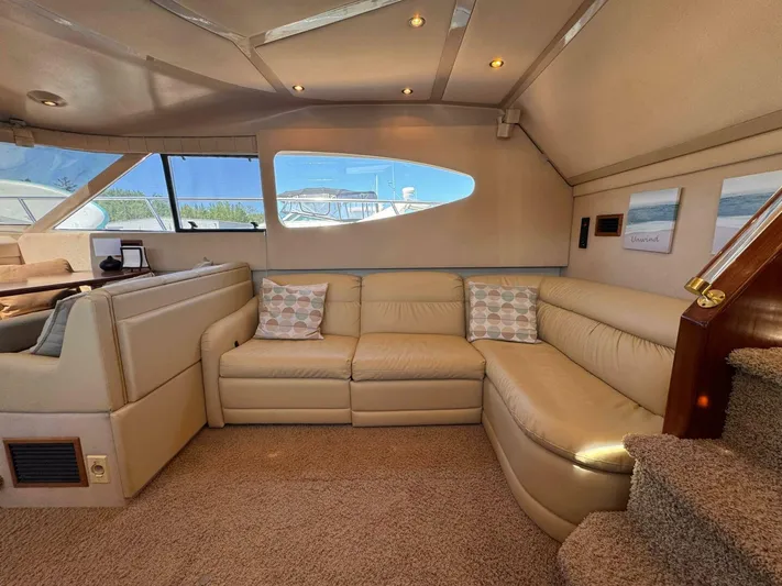  Yacht Photos Pics Luxurious interior of 2002 Cruisers Yachts 4450 Express Motor Yacht with beige leather seating.