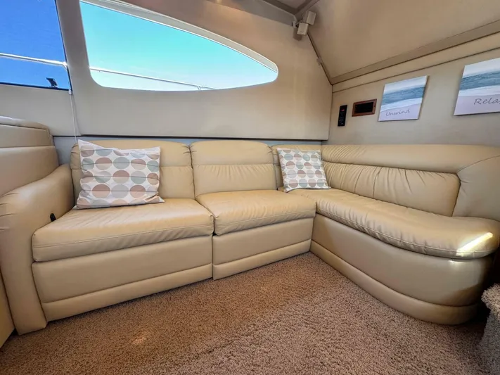  Yacht Photos Pics Luxurious beige leather seating in 2002 Cruisers Yachts 4450 Express Motor Yacht interior.