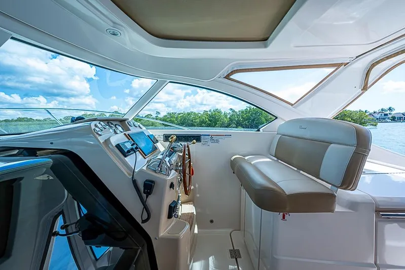 Float Me Alone Too Yacht Photos Pics 2012 Tiara Yachts 3100 Coronet helm with leather seating and modern controls.