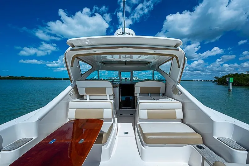 Float Me Alone Too Yacht Photos Pics 2012 Tiara Yachts 3100 Coronet on water, showcasing spacious seating and sleek design.