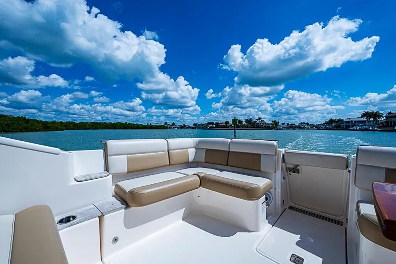 Float Me Alone Too Yacht Photos Pics Luxurious seating on 2012 Tiara Yachts 3100 Coronet, with scenic waterfront view.