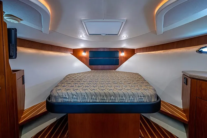 Float Me Alone Too Yacht Photos Pics Luxurious cabin interior of 2012 Tiara Yachts 3100 Coronet with elegant wood finishes.