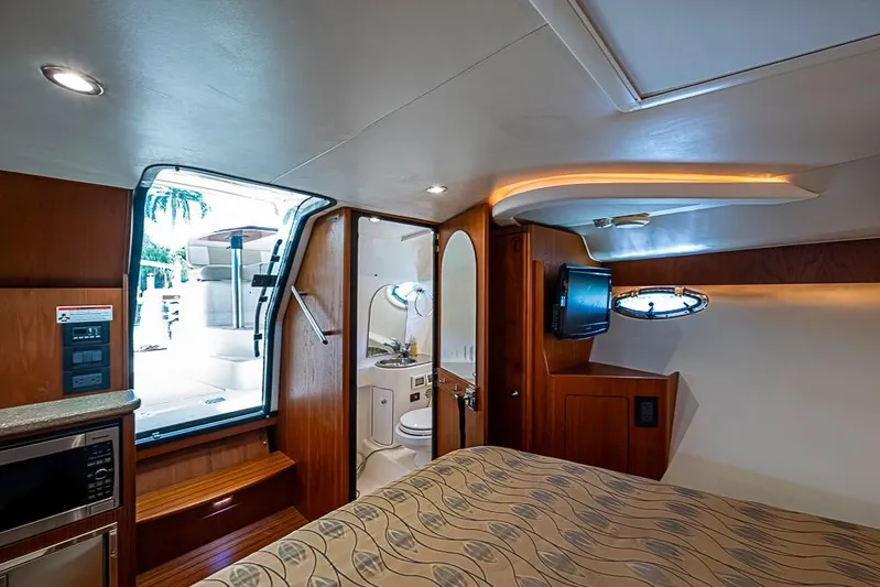 Float Me Alone Too Yacht Photos Pics Luxurious interior of 2012 Tiara Yachts 3100 Coronet with modern amenities and elegant design.