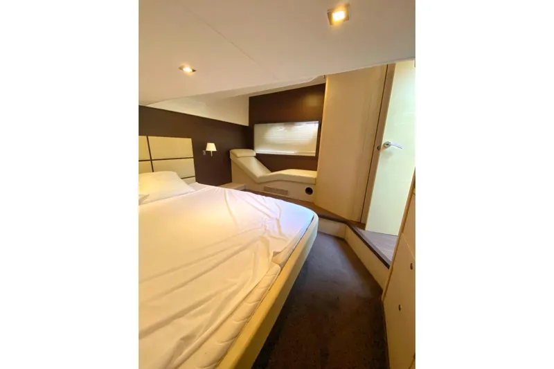  Yacht Photos Pics Luxurious bedroom interior of 2011 Beneteau Monte Carlo 47 Fly yacht, featuring elegant design.
