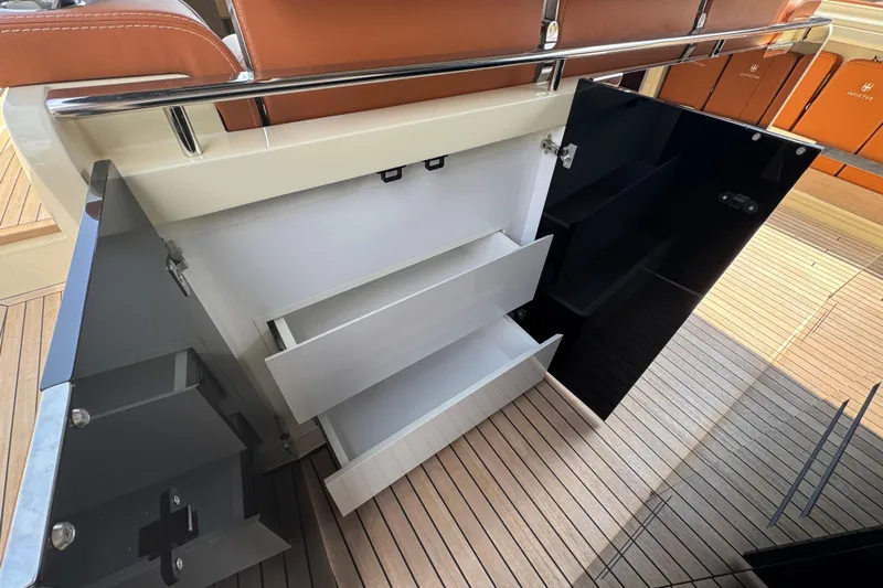  Yacht Photos Pics 2024 Invictus TT460 yacht interior storage with sleek drawers and modern design.
