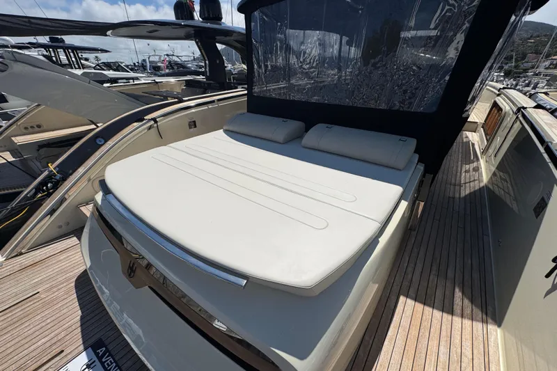  Yacht Photos Pics 2024 Invictus TT460 yacht with sunbed and sleek design at marina.