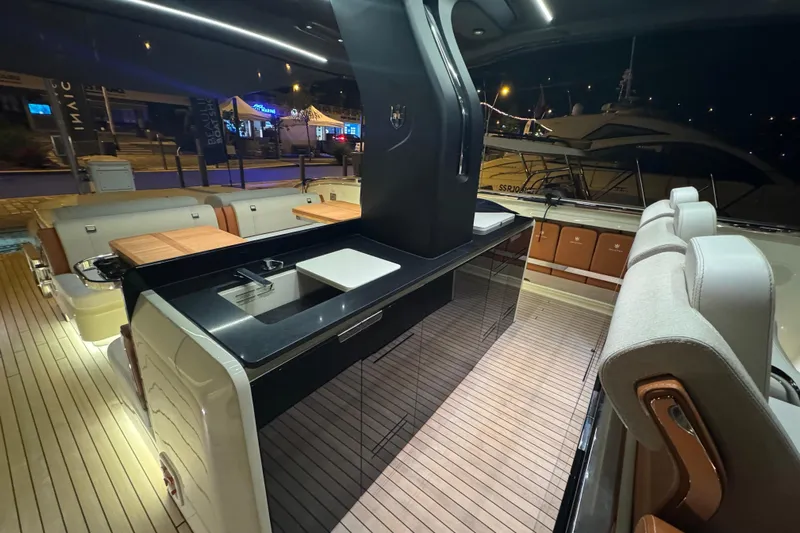  Yacht Photos Pics Luxurious 2024 Invictus TT460 yacht interior with sleek design and modern amenities.