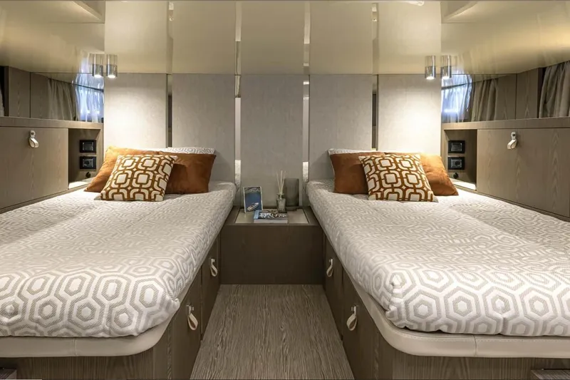  Yacht Photos Pics Luxurious twin cabin interior of 2024 Invictus TT460 yacht with modern decor.