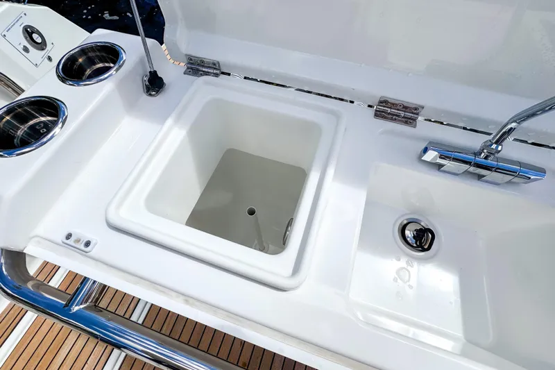  Yacht Photos Pics Wellcraft 38 Explorer 2025 boat sink and faucet with cup holders on deck.