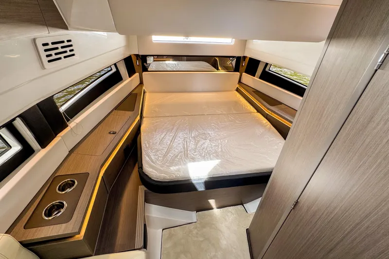  Yacht Photos Pics Luxurious interior cabin of 2025 Wellcraft 38 Explorer yacht with modern furnishings.