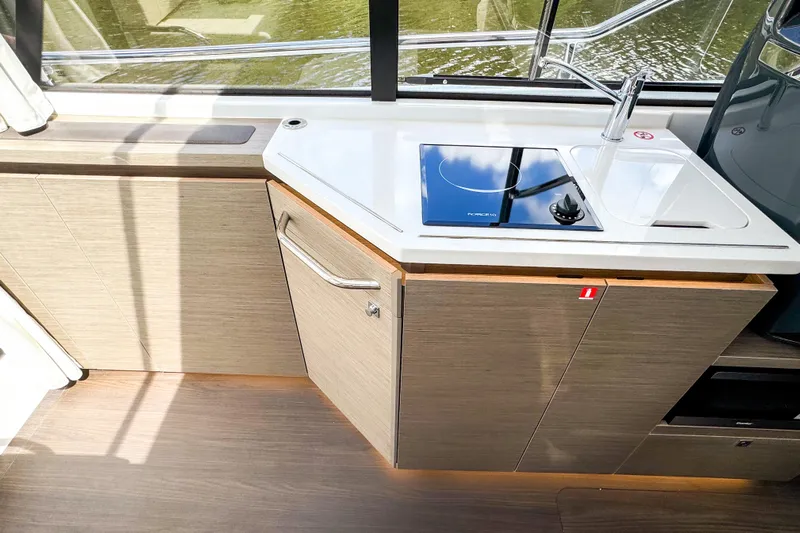  Yacht Photos Pics Modern kitchen area in 2025 Wellcraft 38 Explorer yacht with sleek design and appliances.