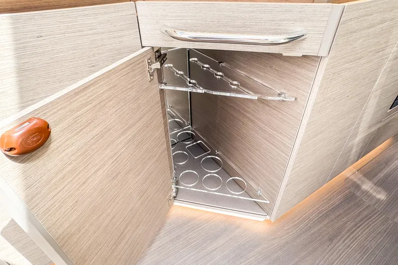  Yacht Photos Pics 2025 Wellcraft 38 Explorer interior cabinet with wine rack and modern design.