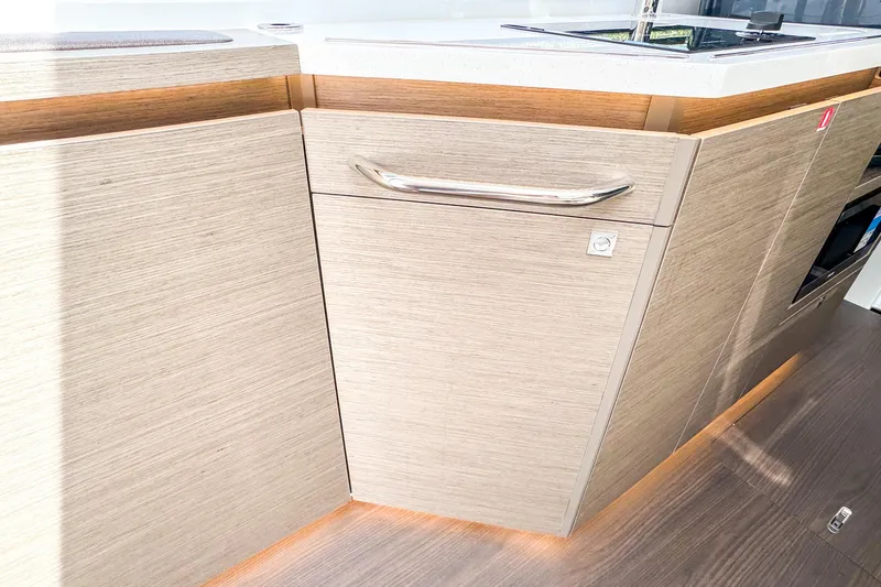  Yacht Photos Pics Modern kitchen cabinetry in 2025 Wellcraft 38 Explorer yacht, featuring sleek design and wood finish.