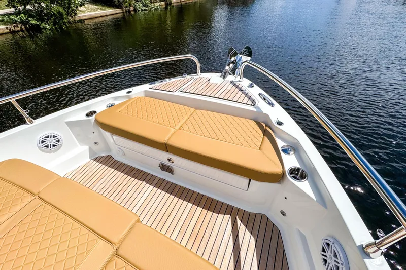  Yacht Photos Pics 2025 Wellcraft 38 Explorer boat with tan cushioned seating and sleek deck design.