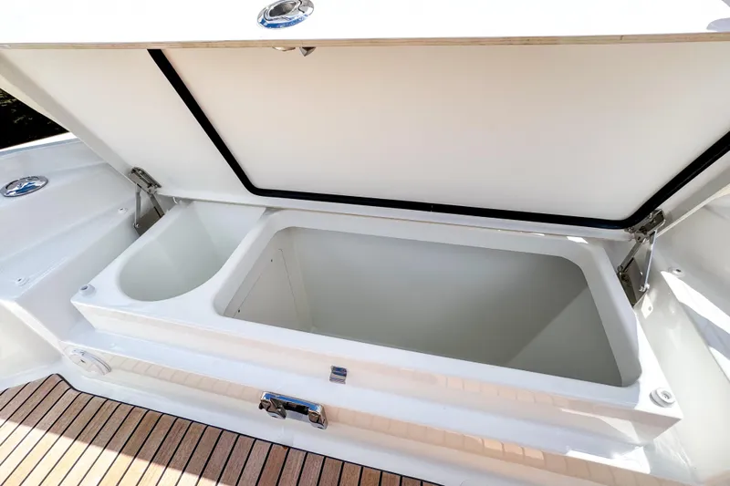  Yacht Photos Pics Open storage compartment on 2025 Wellcraft 38 Explorer boat, featuring sleek design and spacious interior.