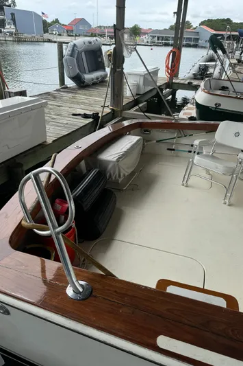 Half Fast Yacht Photos Pics 1992 Post 46 Sportfish boat docked, featuring spacious deck and seating area.