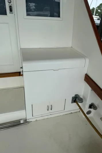 Half Fast Yacht Photos Pics 1992 Post 46 Sportfish boat interior with white storage compartment.