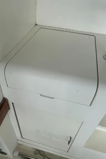 Half Fast Yacht Photos Pics 1992 Post 46 Sportfish boat interior storage compartment with white finish.