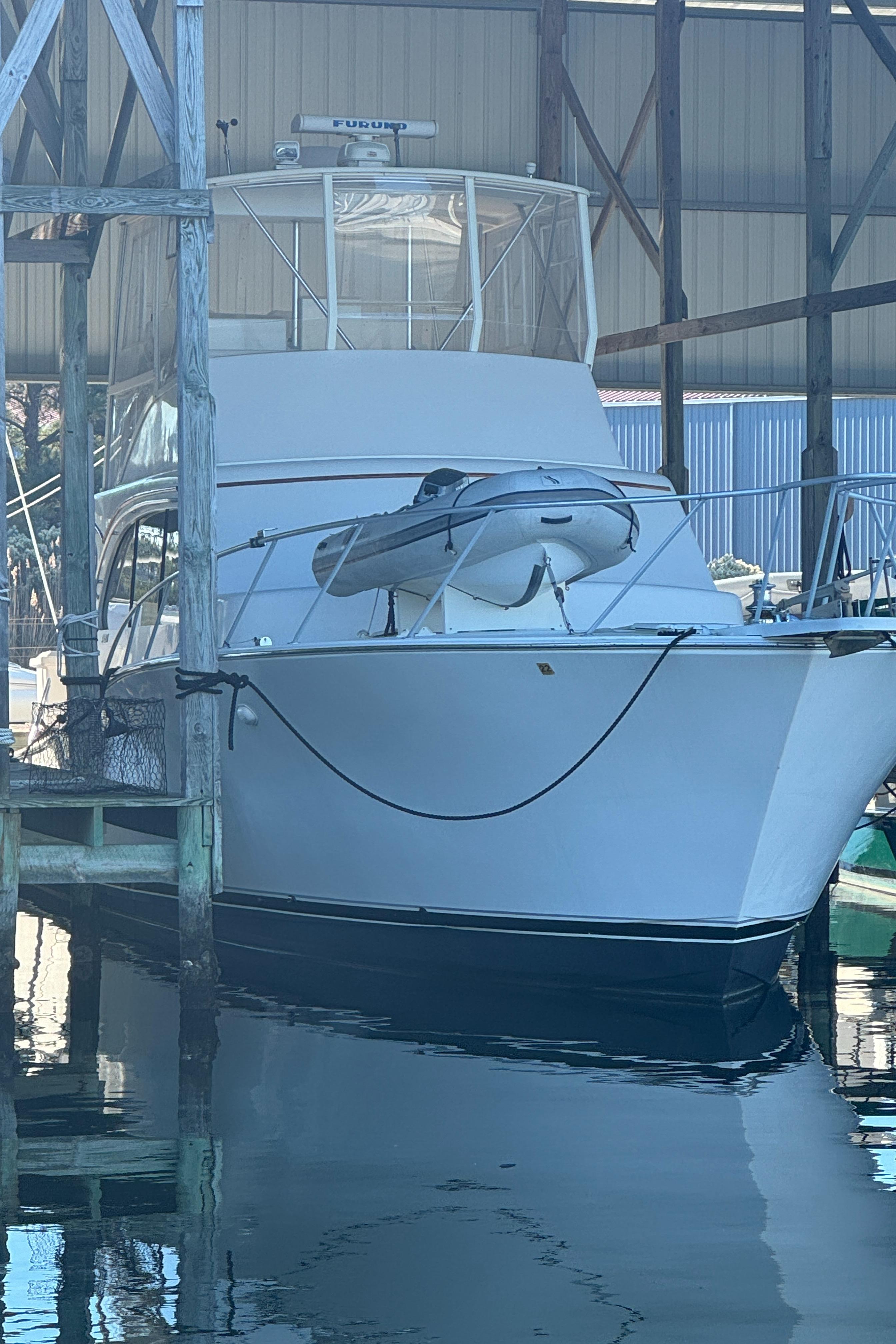 1992 Post 46 Sportfish boat docked in a marina, front view.
