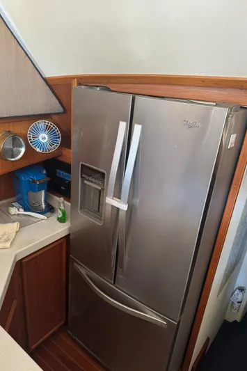Half Fast Yacht Photos Pics Stainless steel refrigerator in 1992 Post 46 Sportfish yacht kitchen.