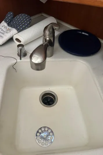 Half Fast Yacht Photos Pics 1992 Post 46 Sportfish kitchen sink with stainless steel faucet and accessories.