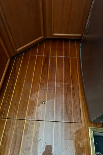 Half Fast Yacht Photos Pics Wooden interior flooring of a 1992 Post 46 Sportfish boat.
