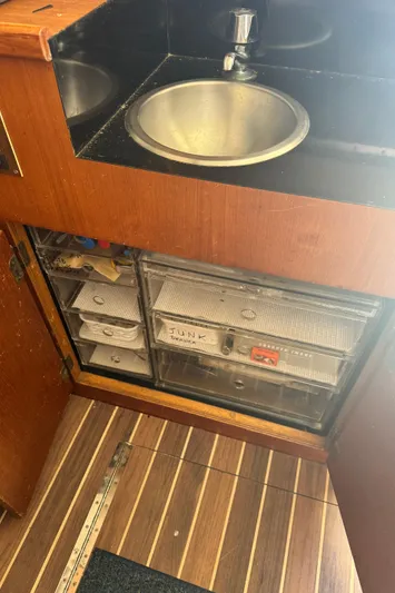 Half Fast Yacht Photos Pics 1992 Post 46 Sportfish interior with sink and storage drawers.