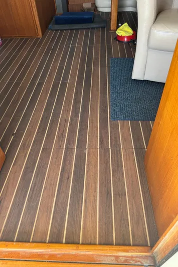 Half Fast Yacht Photos Pics Interior view of 1992 Post 46 Sportfish boat with wooden flooring.