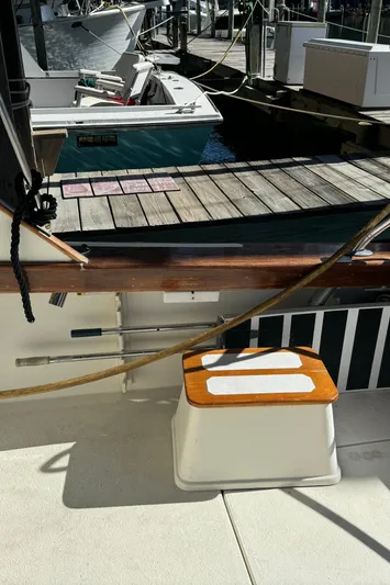 Half Fast Yacht Photos Pics 1992 Post 46 Sportfish boat docked, featuring deck details and nearby vessels.