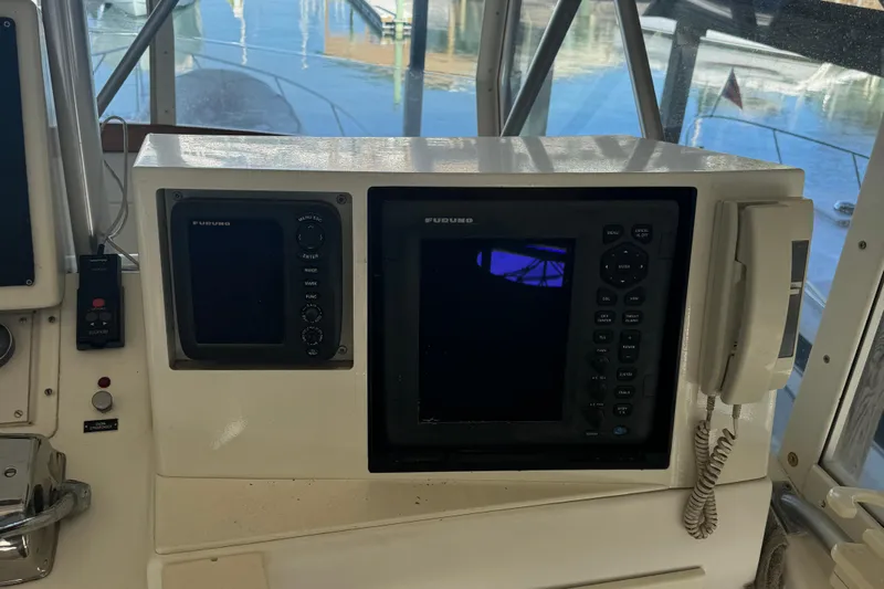 Half Fast Yacht Photos Pics 1992 Post 46 Sportfish boat dashboard with navigation equipment and controls.