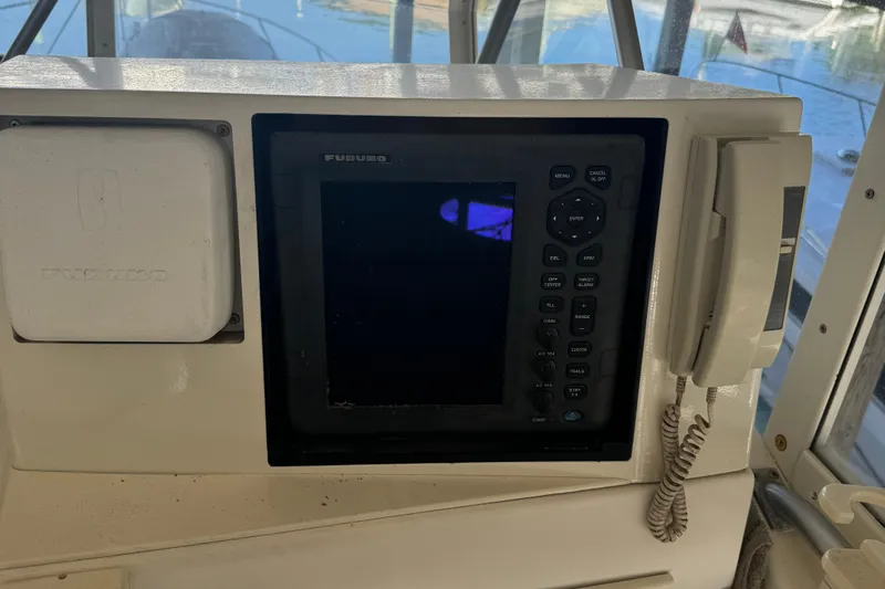 Half Fast Yacht Photos Pics Control panel of a 1992 Post 46 Sportfish boat with navigation equipment.
