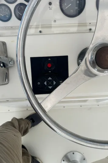 Half Fast Yacht Photos Pics Steering wheel and controls of a 1992 Post 46 Sportfish boat.