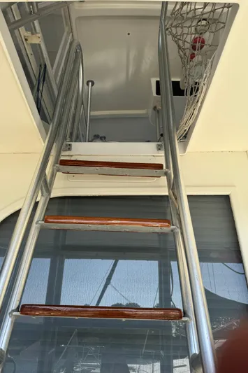 Half Fast Yacht Photos Pics Stainless steel ladder on 1992 Post 46 Sportfish boat, leading to upper deck.