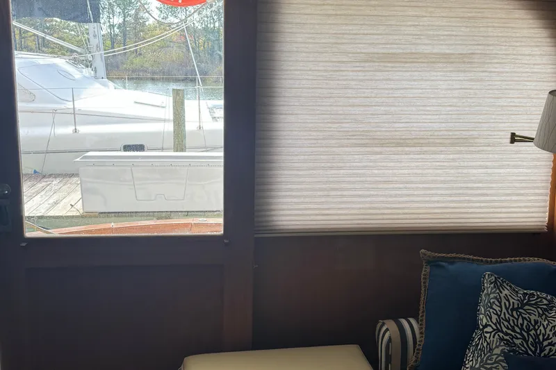 Half Fast Yacht Photos Pics Interior view of a 1992 Post 46 Sportfish yacht with window and seating area.