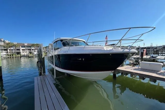  Yacht Photos Pics 2022 Regal 38 XO boat docked at marina under clear blue sky.