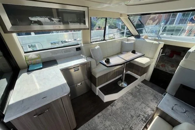  Yacht Photos Pics Luxurious interior of 2022 Regal 38 XO yacht with modern seating and dining area.