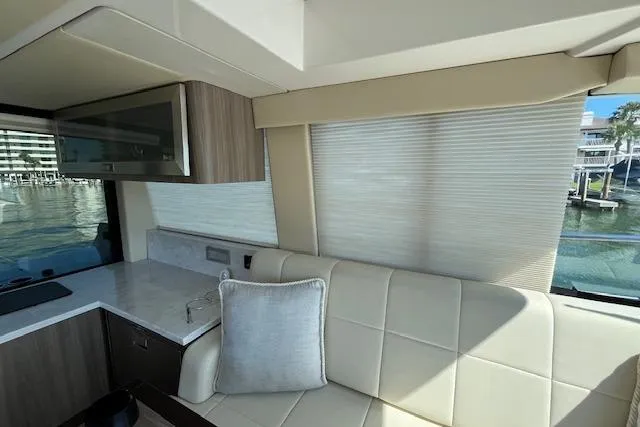  Yacht Photos Pics Interior of 2022 Regal 38 XO yacht with modern seating and window view.