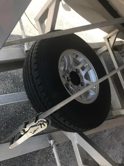  Yacht Photos Pics Spare tire secured on a 2013 Nor-Tech 4000 Roadster trailer.