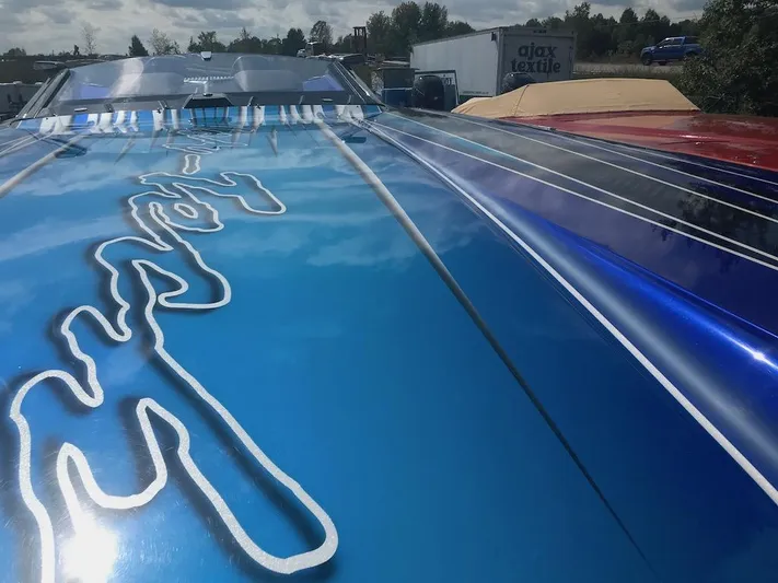  Yacht Photos Pics 2013 Nor-Tech 4000 Roadster with custom blue and red paint job.