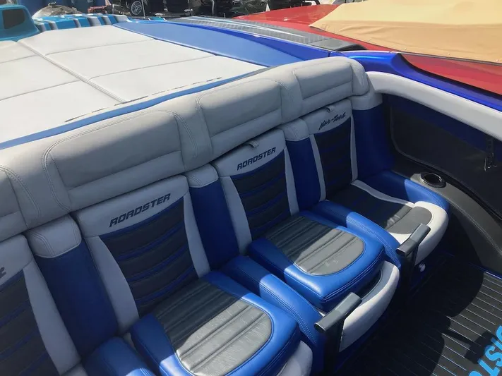  Yacht Photos Pics 2013 Nor-Tech 4000 Roadster boat interior with blue and gray seating.